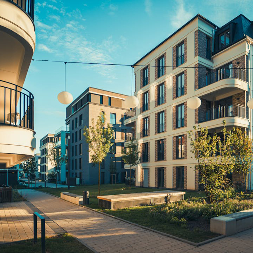 Multi-story buildings with balconies along an urban street