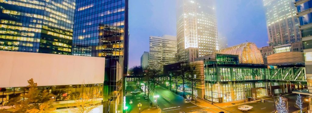 Glass office buildings with illuminated windows